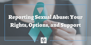woman holding teal ribbon